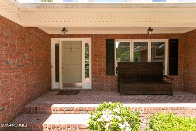 property entrance featuring a porch