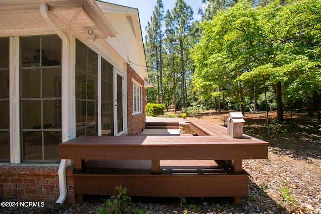 wooden terrace featuring a sunroom