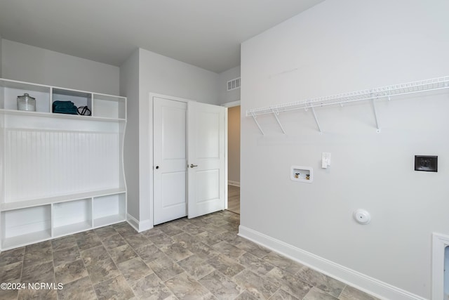 bathroom with ceiling fan, a towering ceiling, and hardwood / wood-style flooring