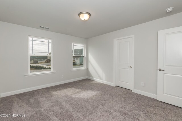 empty room featuring carpet flooring