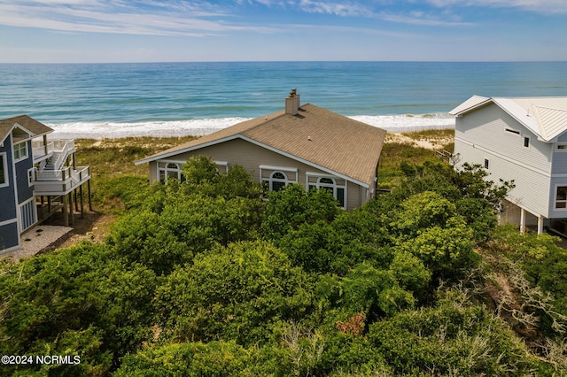 aerial view with a water view and a view of the beach