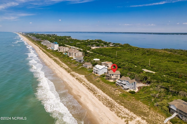 drone / aerial view featuring a view of the beach and a water view