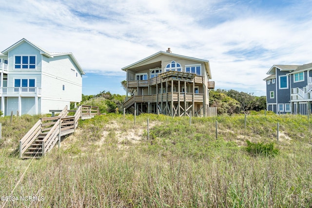 back of property featuring a wooden deck