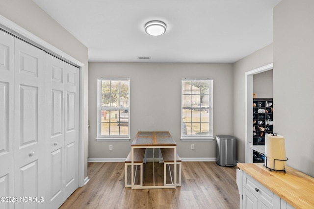 office space with light hardwood / wood-style floors and a wealth of natural light