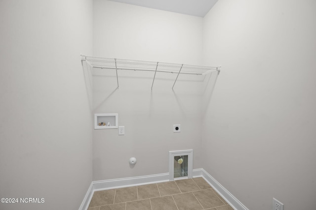 laundry area with washer hookup, electric dryer hookup, hookup for a gas dryer, and baseboards