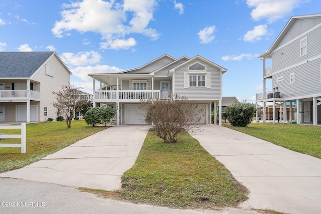 view of front of home featuring a front lawn and a garage