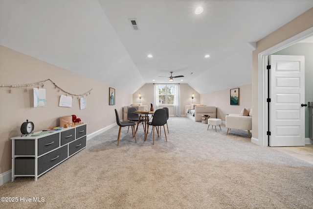 interior space with vaulted ceiling, ceiling fan, and carpet flooring