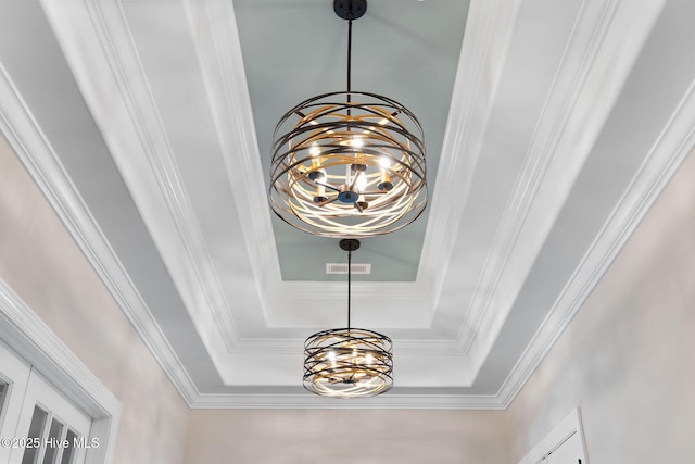 room details with an inviting chandelier and crown molding