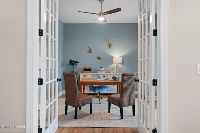 office space with wood-type flooring, ceiling fan, and french doors