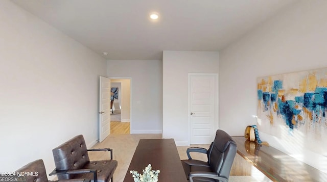 home office with hardwood / wood-style flooring