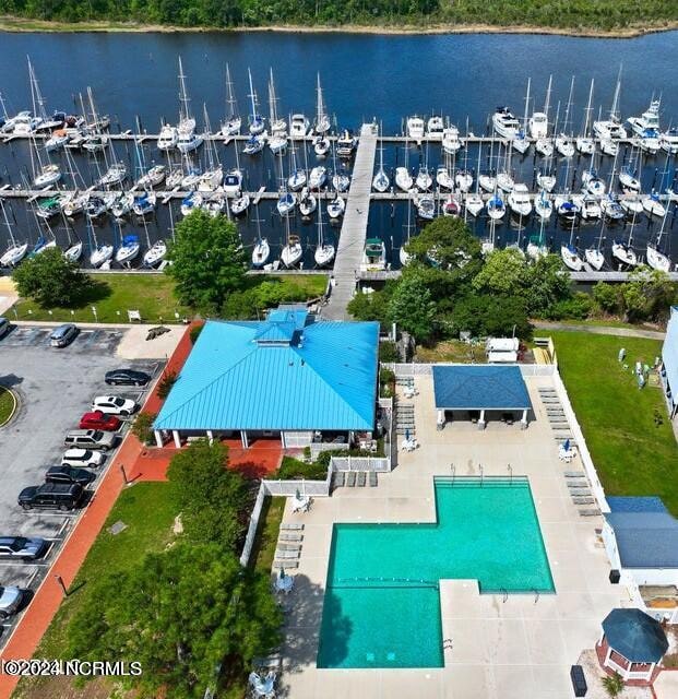 birds eye view of property with a water view