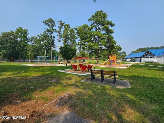 view of nearby features featuring a playground and a lawn