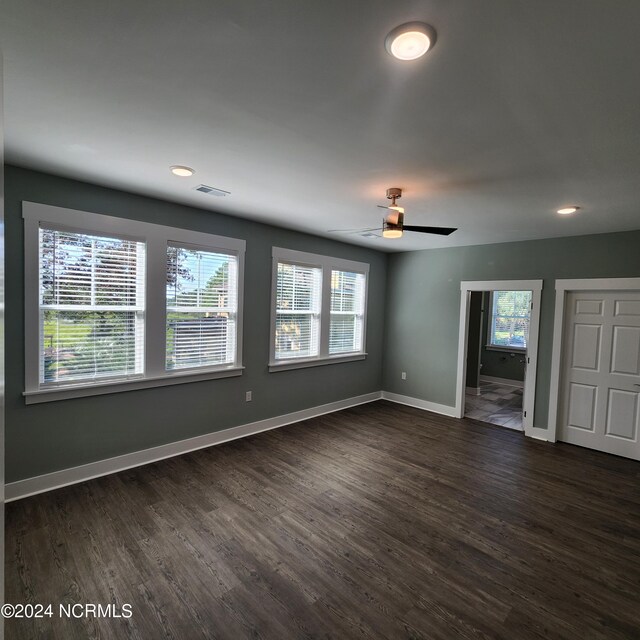 spare room with ceiling fan, crown molding, and dark hardwood / wood-style flooring