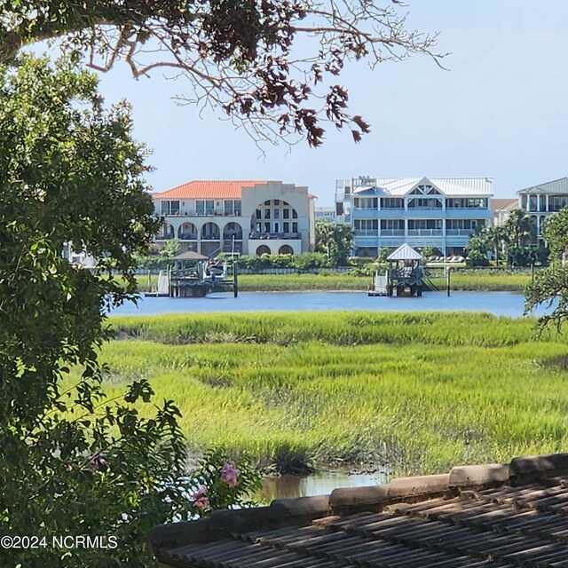 surrounding community with a water view