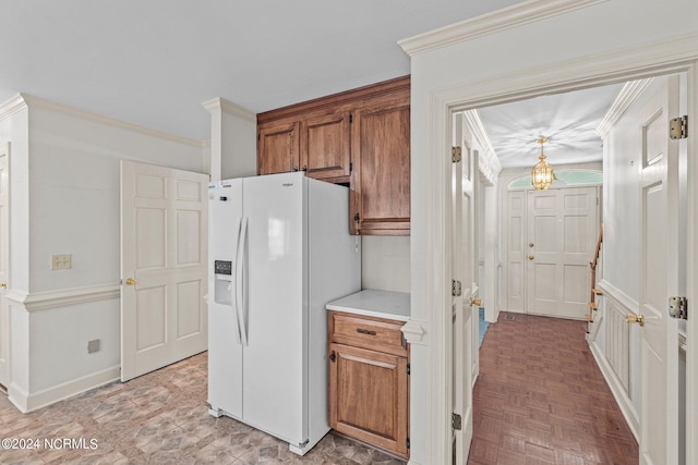 kitchen featuring white refrigerator with ice dispenser, crown molding, and parquet flooring