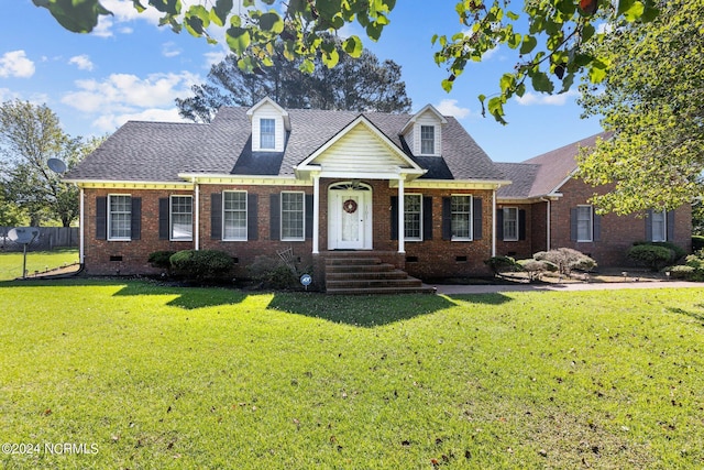 new england style home featuring a front lawn