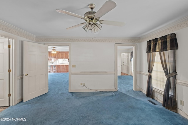 carpeted empty room with crown molding, plenty of natural light, and ceiling fan