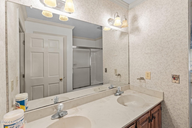 bathroom with a shower with shower door, ornamental molding, and vanity