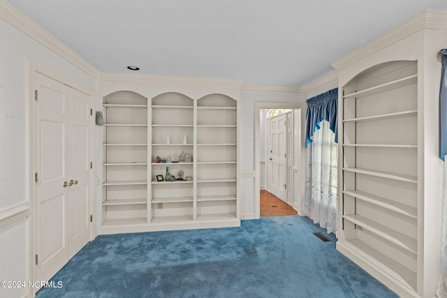 unfurnished room with carpet floors and ornamental molding