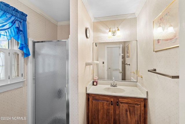 bathroom featuring a shower with shower door, ornamental molding, and vanity