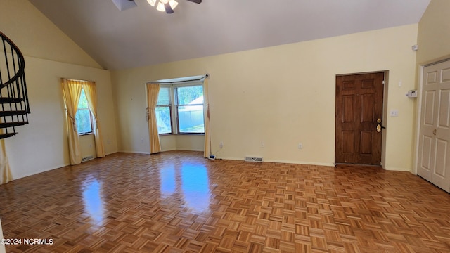 spare room featuring high vaulted ceiling, parquet flooring, and ceiling fan