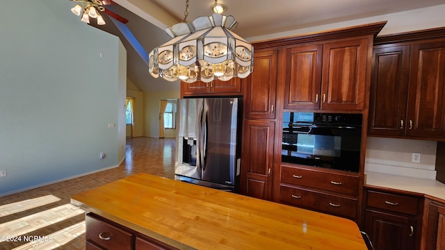 kitchen featuring ceiling fan with notable chandelier, butcher block countertops, light parquet floors, stainless steel refrigerator with ice dispenser, and oven