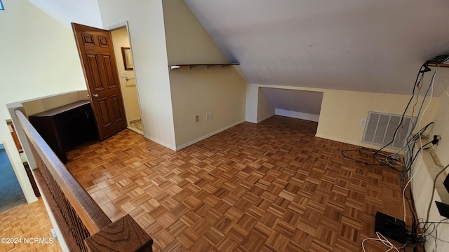 additional living space with lofted ceiling and parquet floors