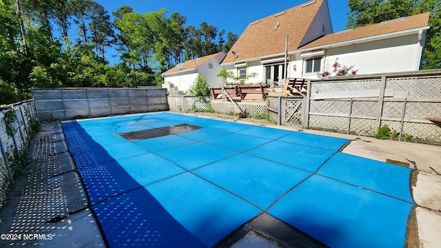 view of pool featuring a wooden deck