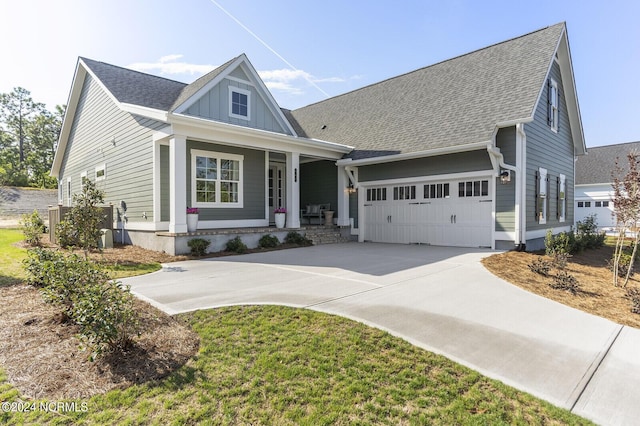 view of front of home with a porch and a garage