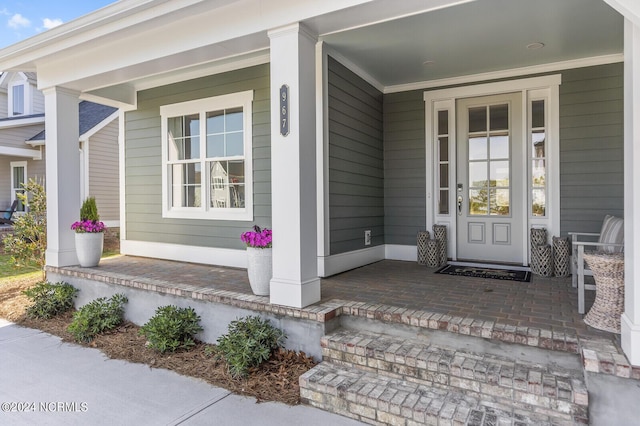 doorway to property featuring a porch