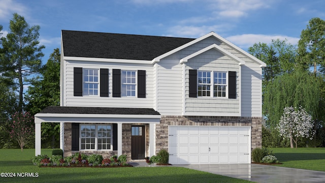 view of front of home with a front lawn and a garage