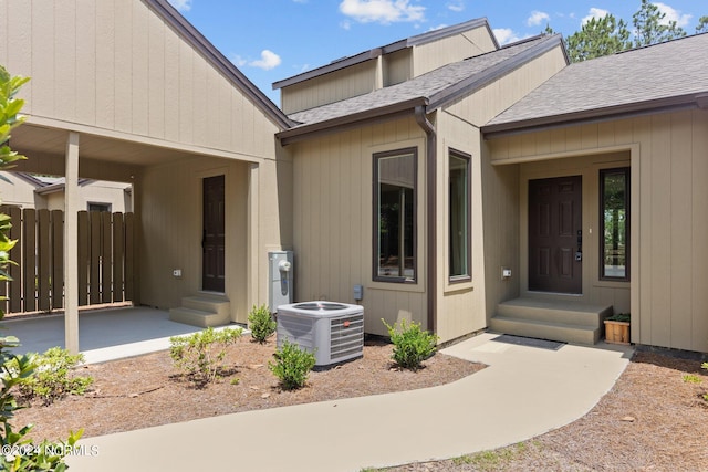 doorway to property featuring cooling unit