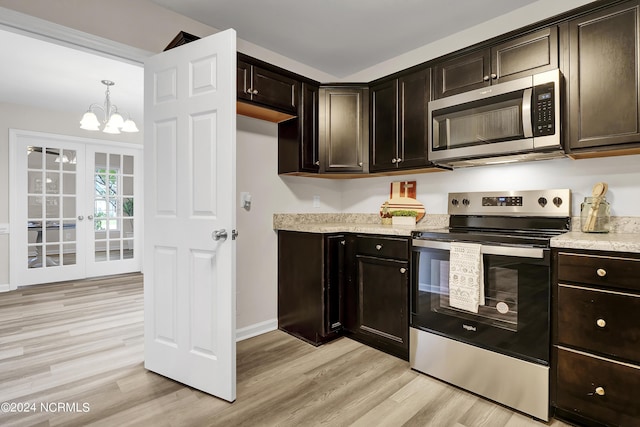 kitchen featuring dark brown cabinetry, appliances with stainless steel finishes, and light hardwood / wood-style flooring