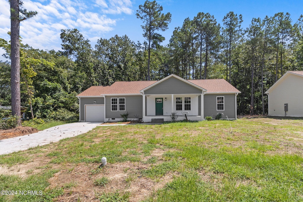 single story home featuring a porch, an attached garage, concrete driveway, crawl space, and a front lawn