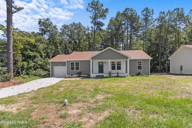 single story home featuring a porch, an attached garage, concrete driveway, crawl space, and a front lawn