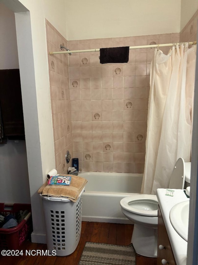 full bathroom featuring toilet, vanity, shower / tub combo, and hardwood / wood-style flooring