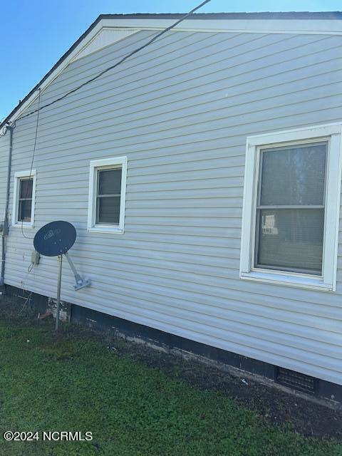 view of home's exterior with crawl space