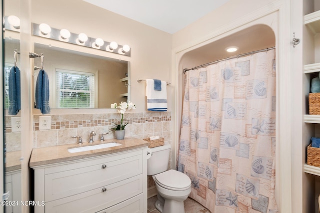 bathroom featuring vanity, tile walls, walk in shower, and toilet