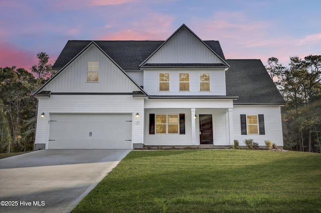 189 Vista Cay Dr, Hubert, NC 28539 - modern inspired farmhouse with board and batten siding, covered porch, a lawn, a shingled roof, and driveway