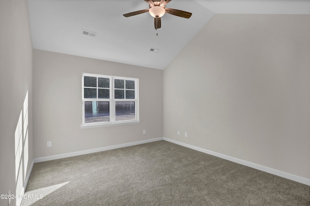 unfurnished room with carpet floors, ceiling fan, and vaulted ceiling