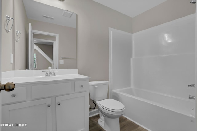 full bathroom featuring shower / tub combination, wood-type flooring, toilet, and vanity