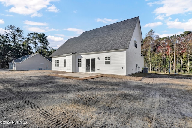 back of house with central AC and a patio