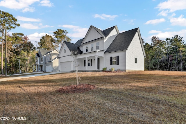 view of front facade with a garage and a front lawn