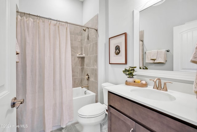 full bathroom with tile patterned flooring, shower / tub combo, vanity, and toilet