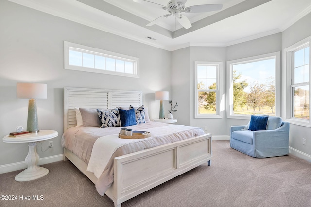 bedroom with light colored carpet, multiple windows, and ceiling fan