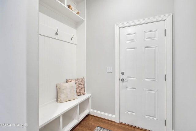 mudroom featuring baseboards and wood finished floors
