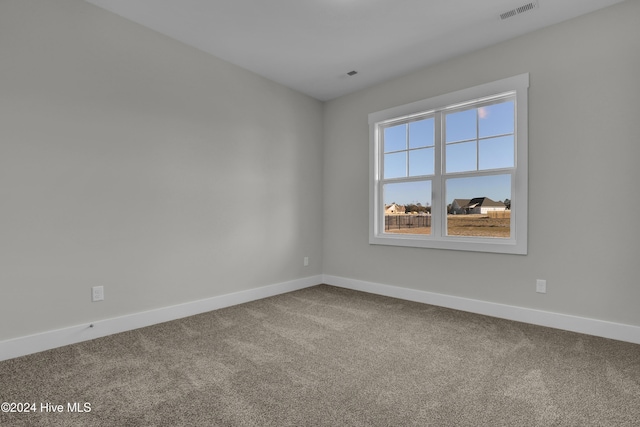 unfurnished room with carpet floors