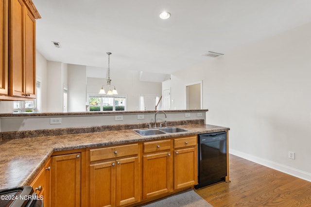 kitchen with pendant lighting, stove, sink, black dishwasher, and dark hardwood / wood-style flooring