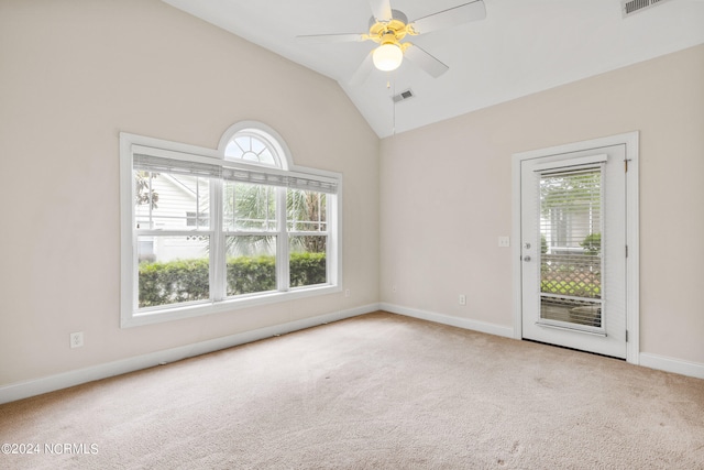 empty room with carpet flooring, ceiling fan, and lofted ceiling