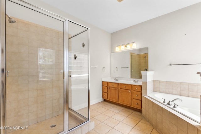 bathroom featuring vanity, tile patterned floors, and independent shower and bath